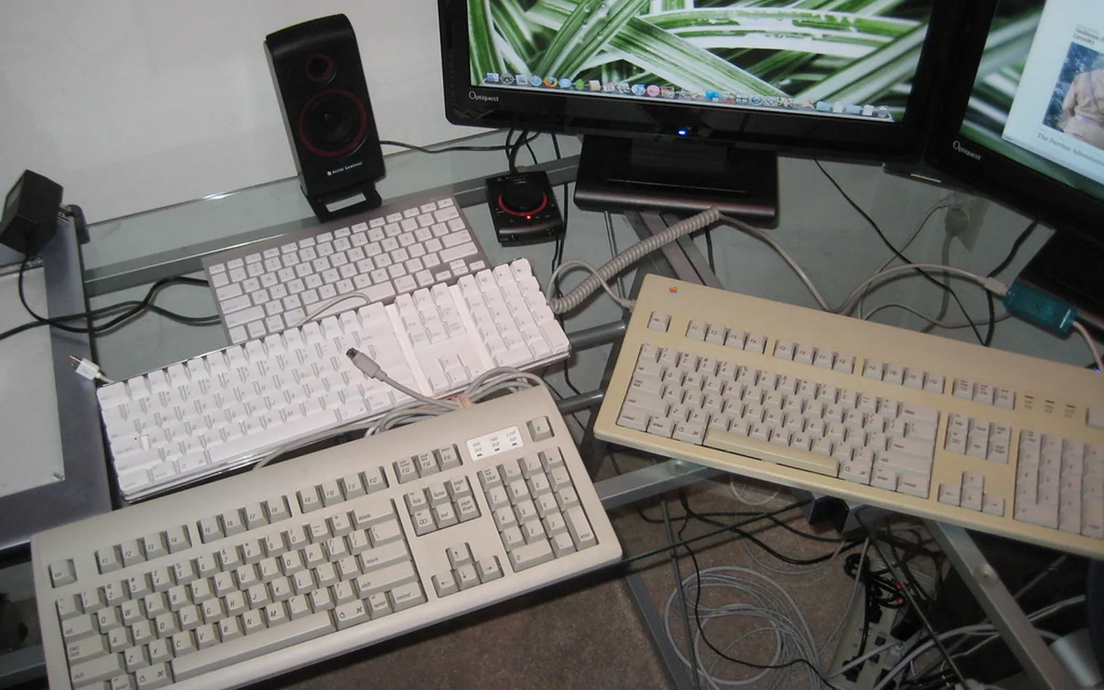 A row of computer keyboards lined up on a table