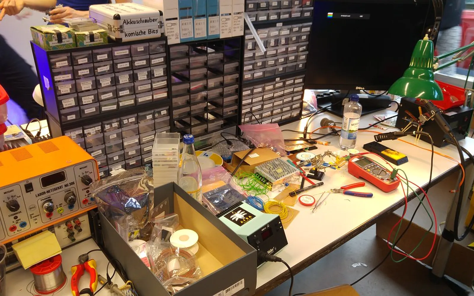 A computer repair workbench with a desktop PC opened up for troubleshooting